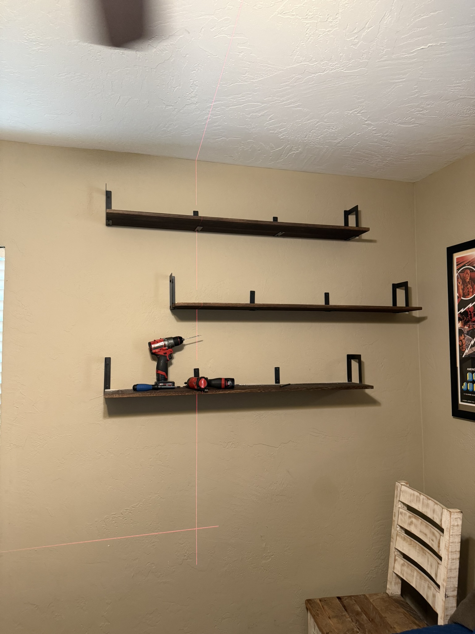 Laser-leveled floating shelf installation